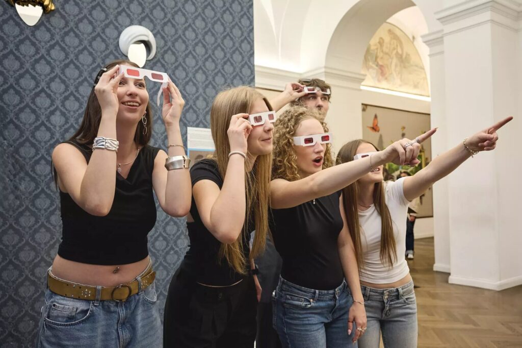Visitors with 3D glasses exploring the gallery at Illusion Art Museum Prague (Image: Kudy z nudy)